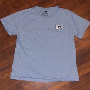 A light blue “The Black Dog” T-shirt